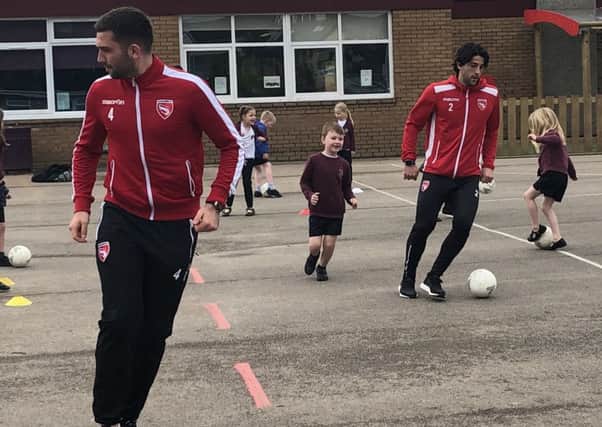Morecambe duo Alex Kenyon and Zak Mills have joined school PE lessons