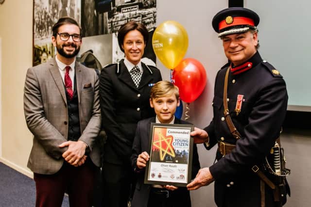 Oliver Routh receives his Young Citizen award, with Russell Millhouse from UCLan, ACC Jo Edwards from Lancashire Constabulary and High Sheriff Tony Attard
