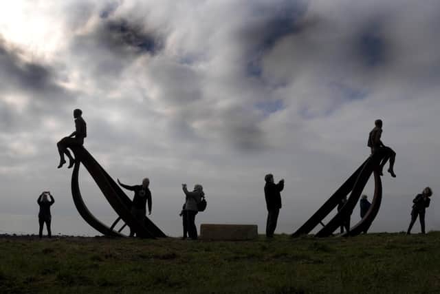A sculpture of a ship and two figures was unveiled at Half Moon Bay.