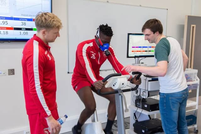 Morecambe FC players try out the new equipment at the sports centre.