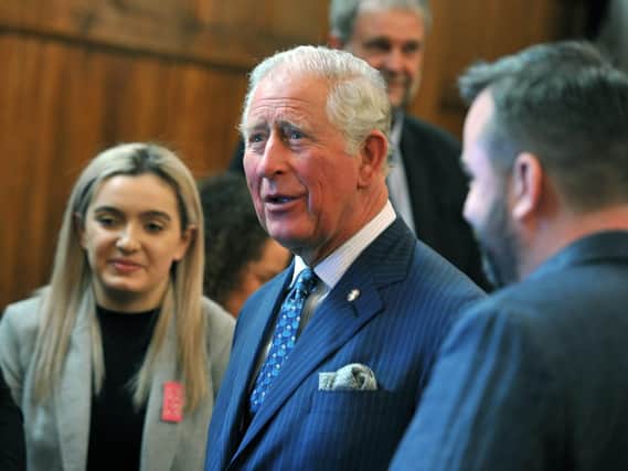Prince Charles meets people from a variety of groups at The Old Courts, Wigan last week.