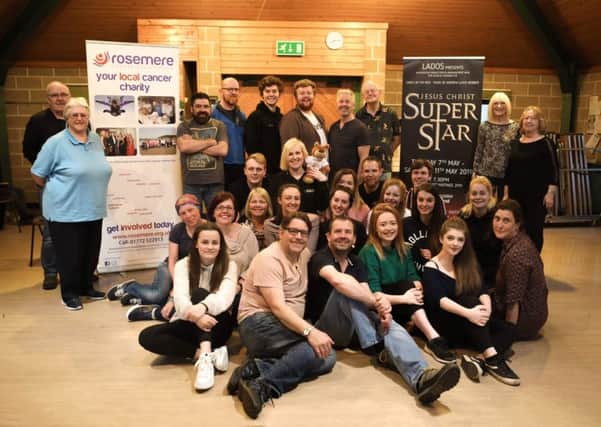 Jesus Christ Superstar cast meet Rosie the Rosemere Cancer Foundation mascot during rehearsals for their upcoming show.