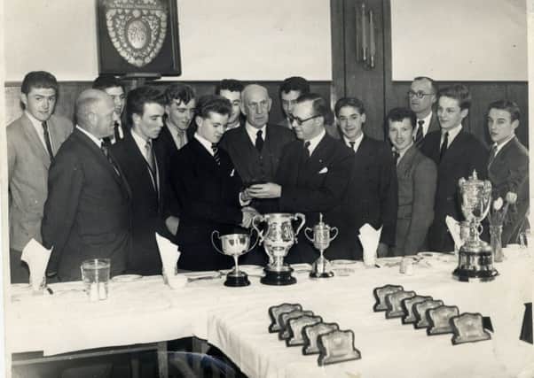 Presentation night at Skerton School by Lancashire Football Association representative and Councillor Price to captain, Brian Walker, and team
L-R: - Ron Gifford, Mr Weaver (headmaster), Keith Walling, Jackie Prickett, Ronnie Moore, Brian Walker, Brian Rogerson, Councillor Price, Stan Askew, FA Representative, Alan Hoyle, Dougie Cohen, Mr Charlie Emmott, David Rucastle, Ronnie Pye.