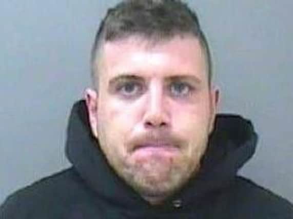 Brendan Harrington, 35, had been wanted on suspicion of criminal damage, assault and recall to prison. Pic - Lancashire Police
