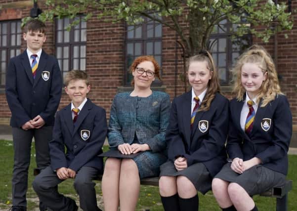 Morecambe Bay Academy Principal Victoria Michael with pupils wearing the new uniform