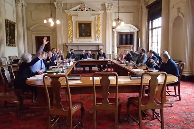 North Yorkshire county councillors vote on whether to close Clapham Primary School.