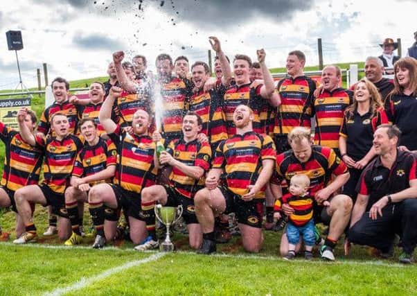 Kirkby Lonsdale rugby club. Picture was taken at the end of the 2016/2017 season when Kirkby went undefeated throughout the season and racked up the highest points total in all English rugby that season. Skipper Ben Walker dealing with the champagne and his proud mum Ruth looking on in the hat.
