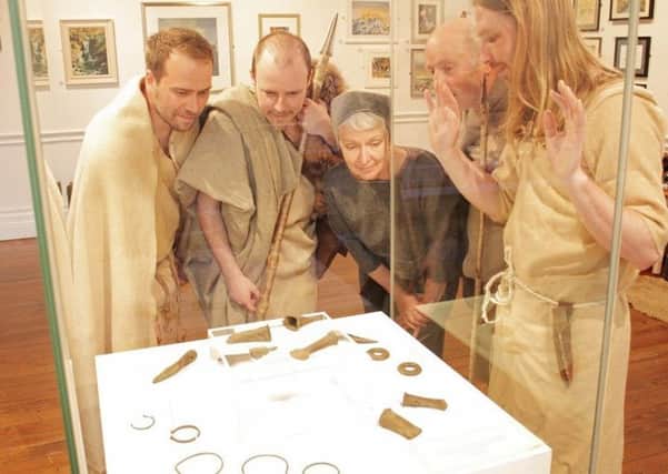 Living history group, The Iron Shepherds admire the newly acquired Scotforth hoard