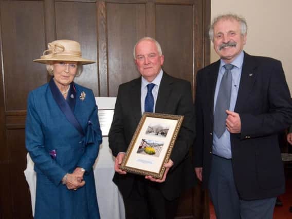The photo is presented to Princess Alexandra by Alan Sandham (Lancaster Charity trustee) and Roger Carradice (chairman). Photo by Steve Pendrill.