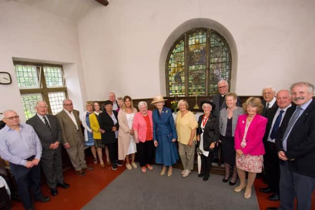 Residents, wardens and trustees with Princess Alexandra in the chapel of Penny's Hospital Almshouses. Photo by Steve Pendrill.