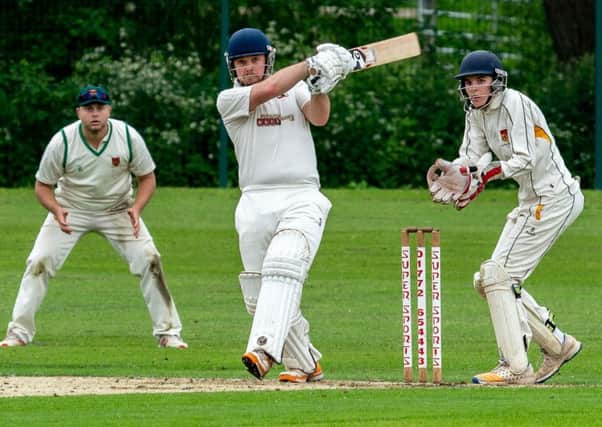 Garstang CC's Mark Walling hits a boundary against Chorley                  Picture: Tim Gilbert/Preston Photographic Society