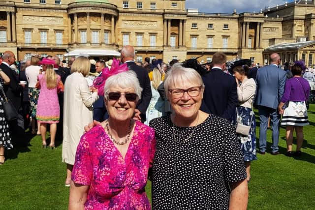 Sue Mann, chair, and Liz Mason, volunteer, at Buckingham Palace at the event recognising volunteers.