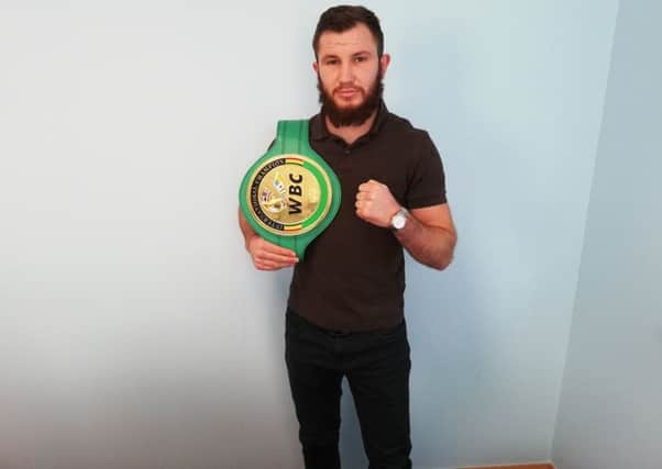 Isaac Lowe with his WBC International belt.