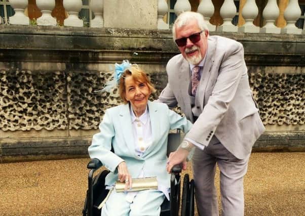 Den Bray at Buckingham Palace with wife Judith.