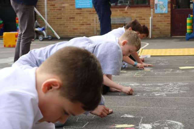 Orchard class takes part in the chalk competition.