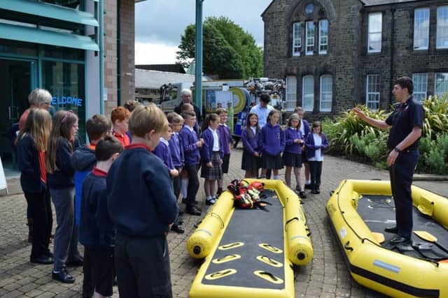 Members of Lancashire Fire and Rescue Service explain their water rescue work to children attending the flood awareness day at the University of Cumbria, Bowerham Road, Lancaster on Thursday 6 June 2019