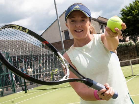 Robyn Moore, who suffers from Post Traumatic Stress Disorder (PTSD), is aiming to hit more tennis balls in one month than any other tennis player has done. Photo: Kelvin Stuttard
