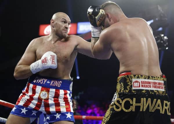 Tyson Fury on his way to victory over Tom Schwarz