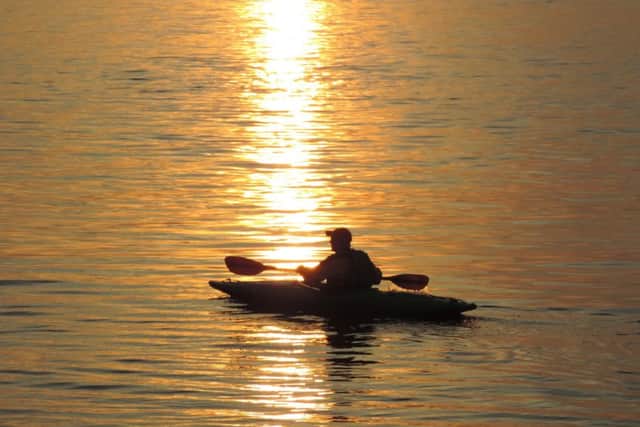 Canoeist on Morecambe Bay at sunset by Spencer Ross