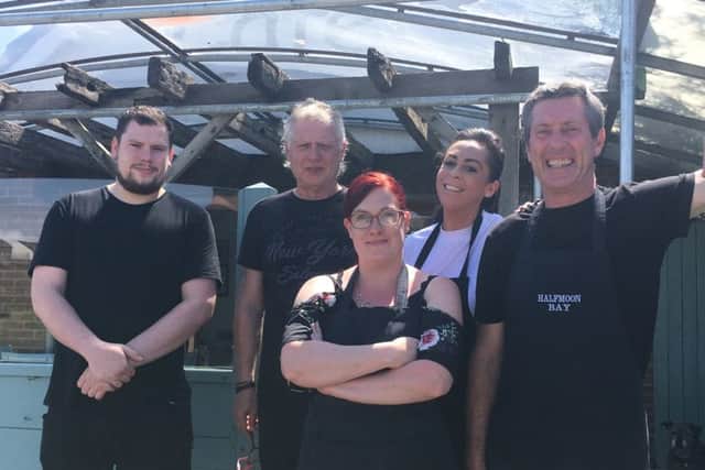 Tony Smith, right, with staff at Half Moon Bay Cafe