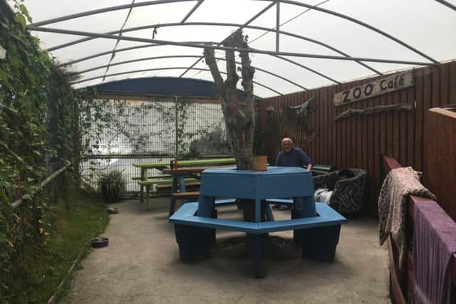 The covered seating area at the back of the cafe
