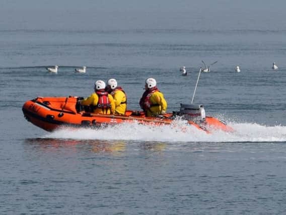 Morecambes volunteer lifeboat crew were tasked by HM Coastguard to assist in the rescue of a couple in their car after they became cut off by the tide in Shore Road, Silverdale