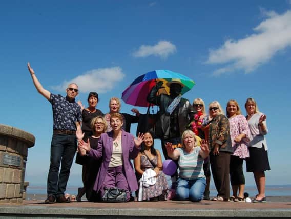 Traders celebrate the anniversary of the statue