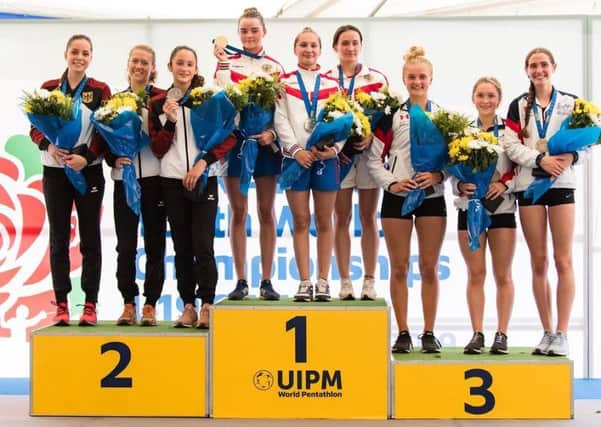 Emma Whitaker, third from the right, on the podium after winning team bronze at the modern pentathlon World Under-19s Championships.