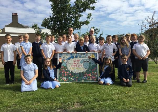 Children from North Road Community Primary School with their artwork designed to promote rail safety.