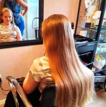 Alys Sharp waiting for her haircut.