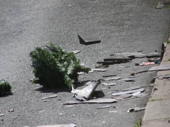 Debris from the roof in the road. Photo by Andrew Goulding.