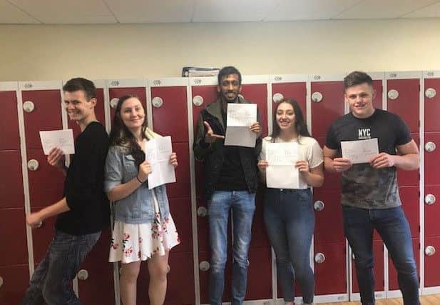 Our Lady's Catholic College pupils collect their A-Level results.