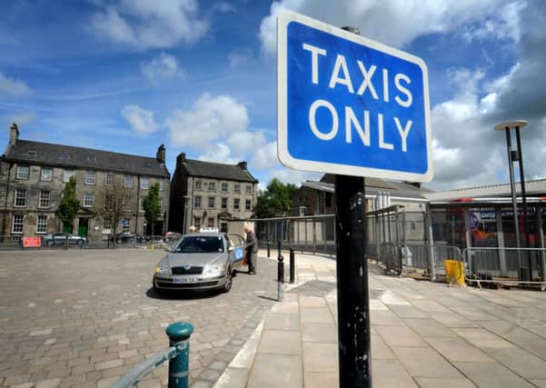 The taxi rank next to the bus station in Lancaster
