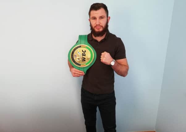 Isaac Lowe with his WBC International belt.