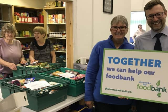 Annette Smith and Craig Allen with volunteers at the Morecambe Foodbank.