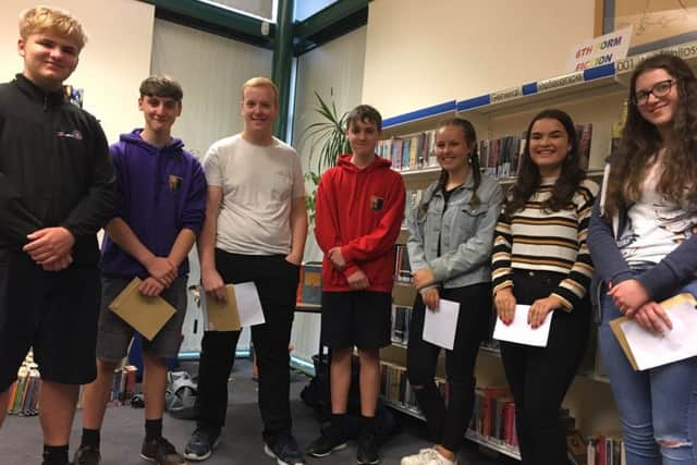 Pupils collect their GCSE results at Dallam School.