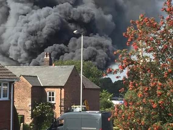 Smoke ploughing from the building in Eccleston. Picture: Jonny Banks