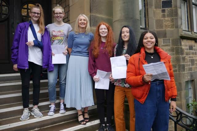 Lancaster Girls' Grammar School head Jackie Cahalin with students celebrating their GCSE results.