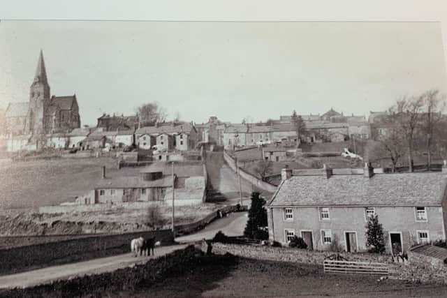 Burton-in-Lonsdale circa 1908. To the left of Burton Bridge stands Greta Bank pottery, owned by William Bateson. It was one of the last surviving potteries in the village. The photograph shows the top of the kiln, surrounded by a hovel, this protected the workers whiilst they shovelled coal into the fire mouths or unpacked the fired pottery. On the hill stands the church of All Saints with its lofty octagonal spire, a visible landmark for miles around.