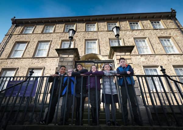 Pupils from Dallas Road Community Primary School, Lancaster, help get the Judges' Lodgings Museum ready for reopening.