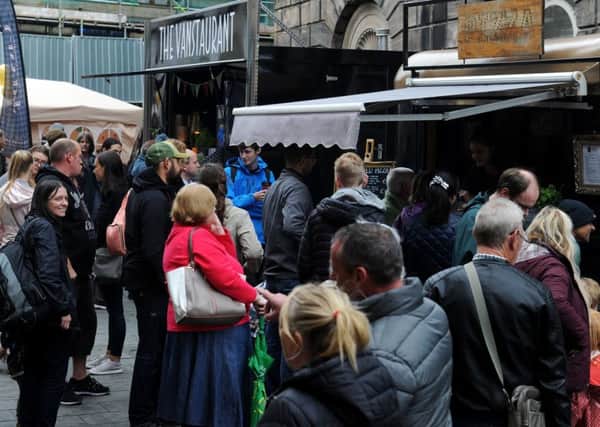 Crowds queue for the Italian food on offer. Picture by Paul Heyes.
