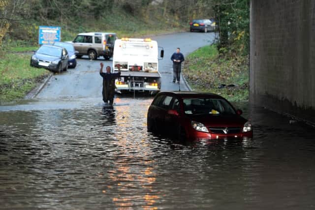 Photo Neil Cross
The floods at Galgate
A car is recovered from under the motorway bridge