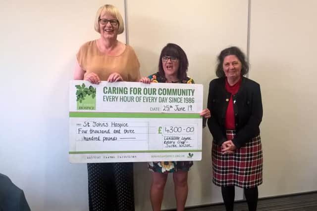 Susan Wilson presenting a cheque from Lancaster Loyne Rotary Club.