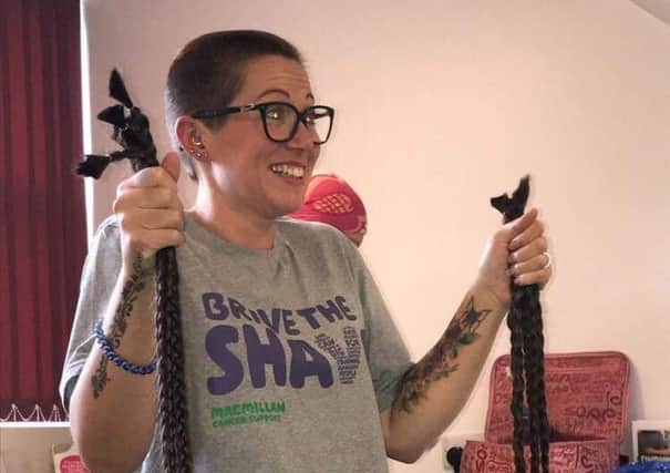 Jodie Boldy with her plaits after she had her head shaved for charity.