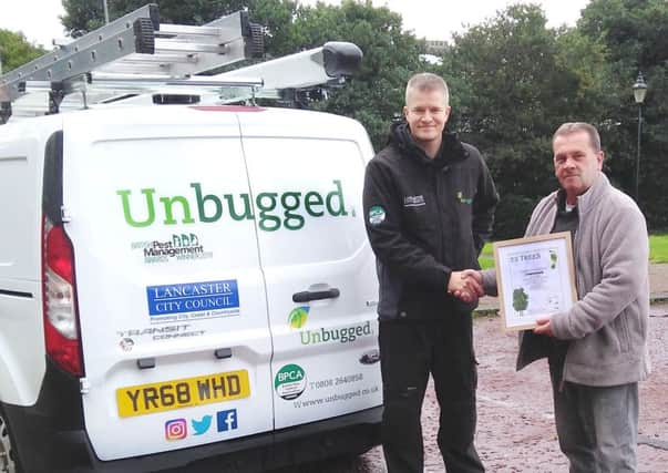 Left Lee Illingworth from Unbugged receives a framed certificate from Ian Hughes of Oakstone Environmental Consulting.