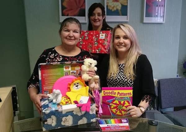 Jan Copestake, Jill Sanctuary and Becky Hulme from Baines Bagguley Penhale with some of the donated shoeboxes.