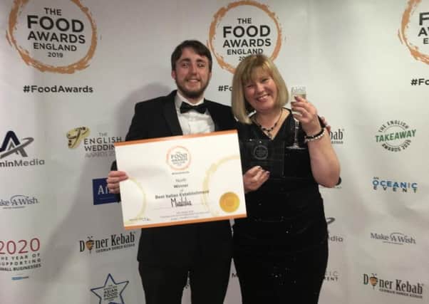 Pizza chef Mathew Doorly and assistant manager Joanne Woodhouse collecting the award at the ceremony in Manchester last week.