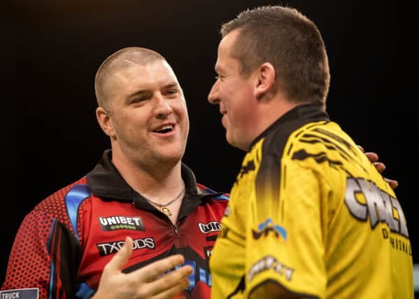 Daryl Gurney and Dave Chisnall at the Unibet European Championship. Picture: Kais Bodensieck/PDC Europe