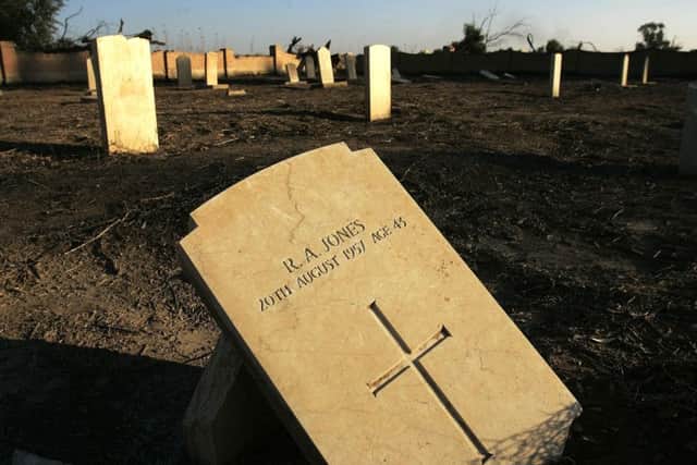 CAMP HABBANIYAH, IRAQ - JANUARY 30:  A grave marker lies on the ground in a British cemetery January 29, 2006 on the grounds of the now American-occupied Camp Habbaniyah, Iraq.  "Habbaniya" was a British-built airbase, created during the British occupation of Iraq in the 1920s and kept for strategic reasons even after Iraq became a sovereign country in 1930.  When Iraq staged a coup and declared an alliance with Germany in April 1941, Britain and Iraq (with German help) fought a two-month war for control of Habbaniya, which Britain won.  British forces finally pulled out in the 1950s, but the battered and neglected churches, pools, and theaters that remain are reminders of Great Britain's long and stormy experience in militarily occupying Iraq.  (Photo by Chris Hondros/Getty Images)