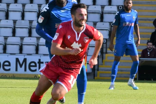 Morecambe midfielder Aaron Wildig